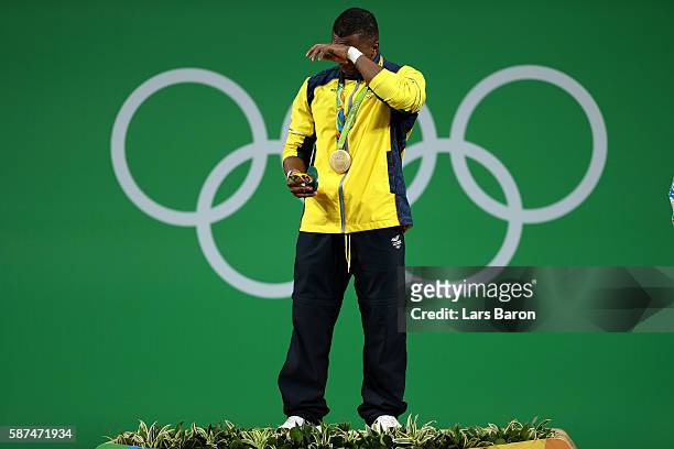 Gold medalist Oscar Albeiro Figueroa Mosquera of Colombia celebrates on the podium during the medal presentation for the Men's 62kg Group A...