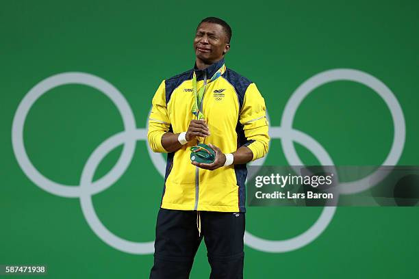 Gold medalist Oscar Albeiro Figueroa Mosquera of Colombia celebrates on the podium during the medal presentation for the Men's 62kg Group A...