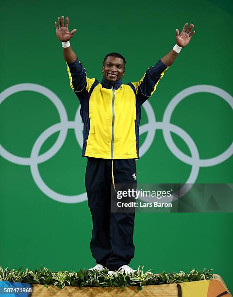 Gold medalist Oscar Albeiro Figueroa Mosquera of Colombia celebrates on the podium during the medal presentation for the Men's 62kg Group A...