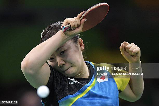 Japan's Ai Fukuhara plays against North Korea's Ri Myong Sun during their women's singles qualification round table tennis match at the Riocentro...