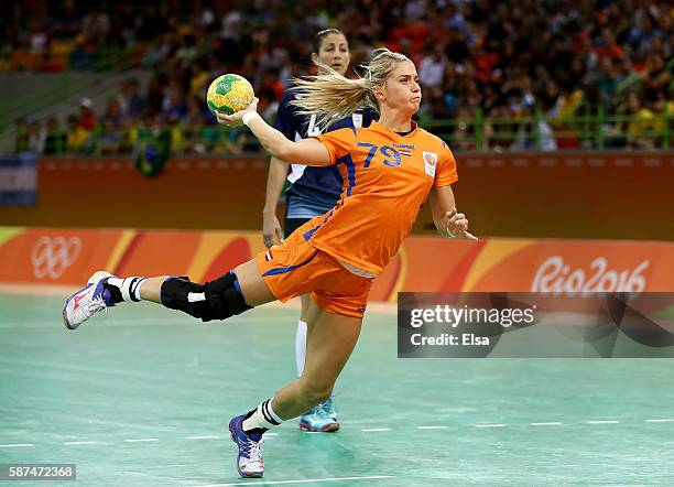 Estavana Polman of Netherlands takes a shot as Lucia Haro of Argentina defends on Day 3 of the Rio 2016 Olympic Games at the Future Arena on August...