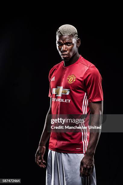 Paul Pogba of Manchester United poses after signing for the club at Aon Training Complex on August 8, 2016 in Manchester, England.