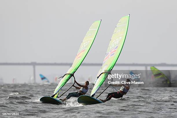 Bryony Shaw of Great Britain competes alongside Marina Alabau Neira of Spain during the Women's RS:X Race 2 on Day 3 of the Rio 2016 Olympic Games at...