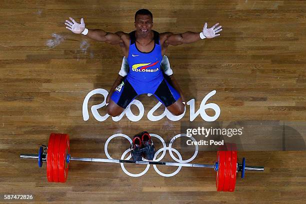 Oscar Albeiro Figueroa Mosquera of Colombia reacts during the Men's 62kg Group A weightlifting contest on Day 3 of the Rio 2016 Olympic Games at the...