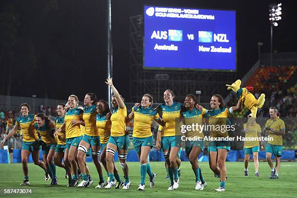 Australia celebrate victory after winning the Women's Gold Medal Final Rugby Sevens match between Australia and New Zealand on August 8, 2016 in Rio...