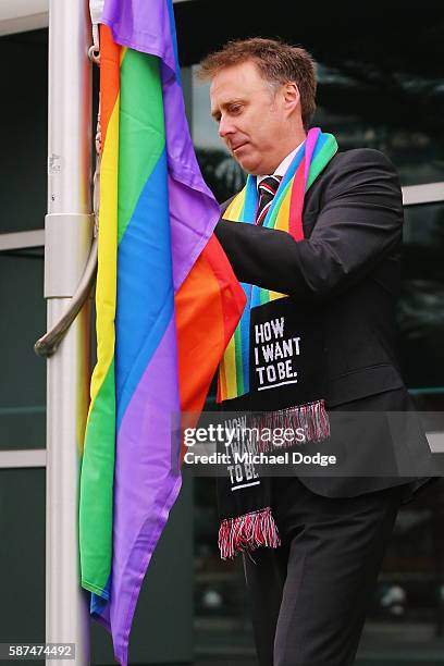 St.Kilda Saints CEO Matt Finnis wears the Pride Game rainbow while raising the Pride Game rainbow flag at AFL house during an AFL media opportunity...