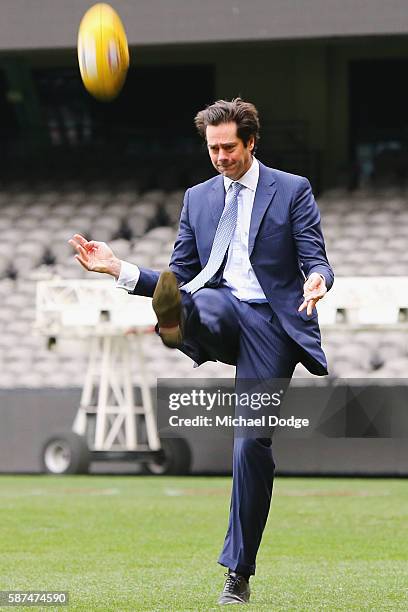 Gillon McLachlan kicks the Pride Game AFL ball during an AFL media opportunity at Etihad Stadium on August 9, 2016 in Melbourne, Australia. St.Kilda...