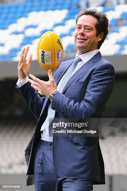 Gillon McLachlan marks the Pride Game AFL ball during an AFL media opportunity at Etihad Stadium on August 9, 2016 in Melbourne, Australia. St.Kilda...