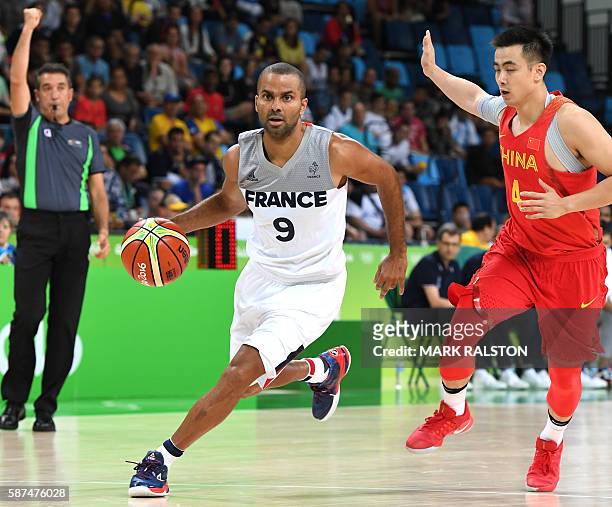 France's point guard Tony Parker runs during a Men's round Group A basketball match between France and China at the Carioca Arena 1 in Rio de Janeiro...