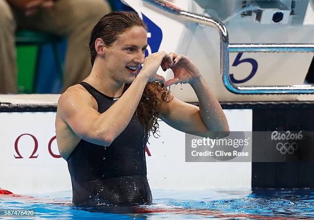 Katinka Hosszu of Hungary celebrates winning Gold in the Women's 100m Backstroke Final on Day 3 of the Rio 2016 Olympic Games at the Olympic Aquatics...