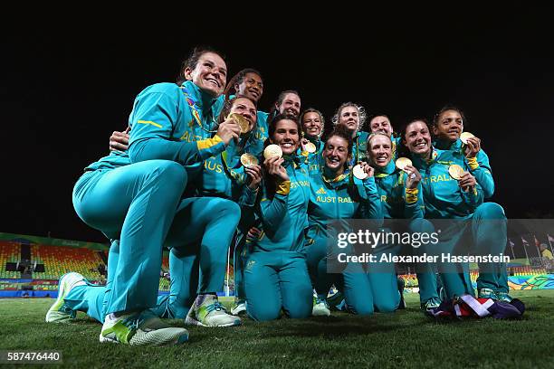 Gold medalist team Australia celebrate after the medal ceremony for the Women's Rugby Sevens on Day 3 of the Rio 2016 Olympic Games at the Deodoro...