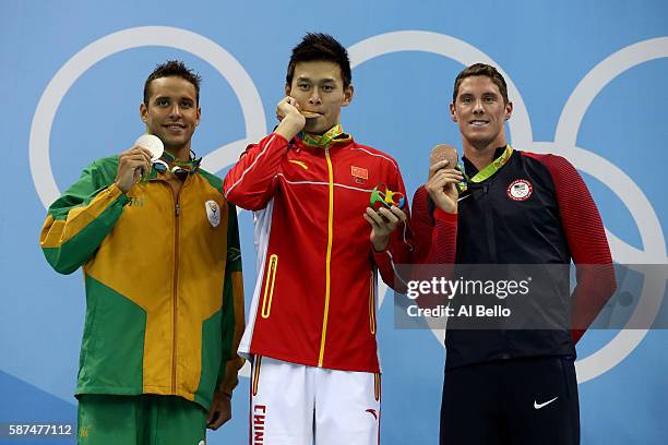 Silver medalist Chad le Clos of South Africa, gold medalist Yang Sun of China and bronze medalist Conor Dwyer of the United States poses on the...