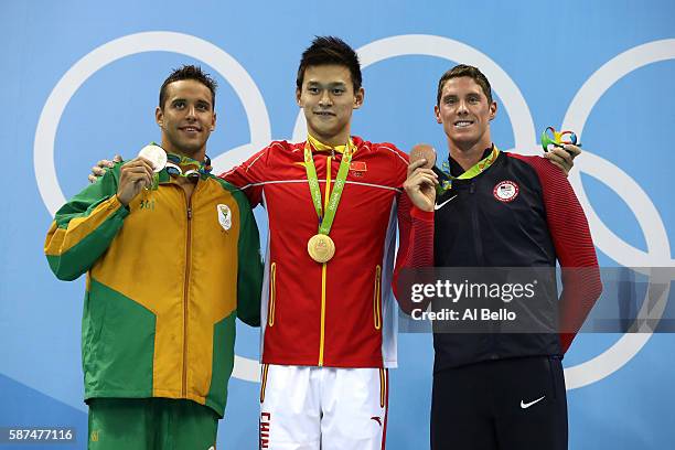 Silver medalist Chad le Clos of South Africa, gold medalist Yang Sun of China and bronze medalist Conor Dwyer of the United States poses on the...