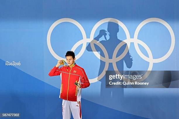 Gold medalist Yang Sun of China poses on the podium during the medal ceremony for the Men's 200m Freestyle Final on Day 3 of the Rio 2016 Olympic...