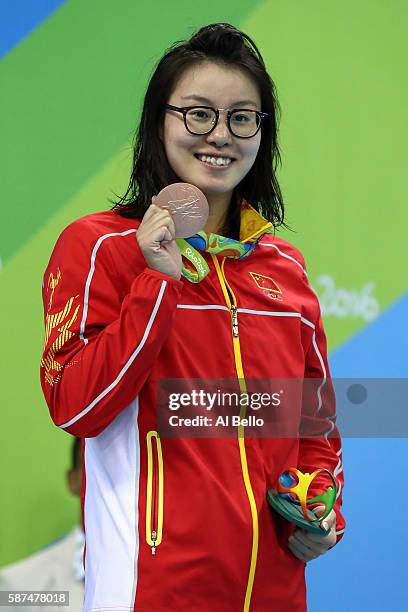 Bronze medalist Yuanhui Fu of China on the podium during the medal ceremony for the Women's 100m Backstroke Final on Day 3 of the Rio 2016 Olympic...