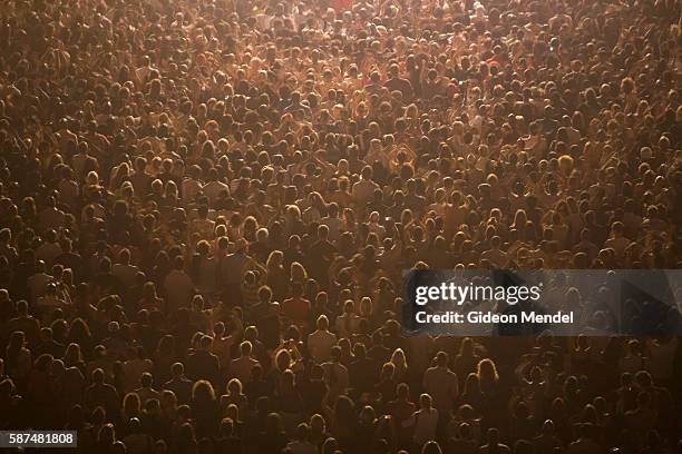 View from above of a standing audience enjoying the music during the annual Somerset House Series. These outdoor concerts within the atmospheric...