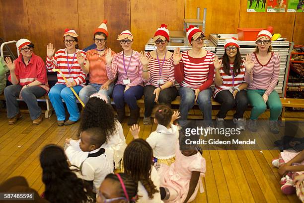 Group of teachers are all dressed up as the Where's Wally character during the school assembly at Kingsmead Primary School in Hackney on World Book...