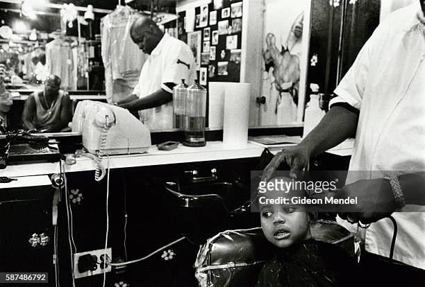 Barber Cutting Child's Hair in Harlem