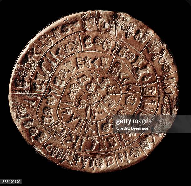 Minoan civilization - Phaistos Disk, Phaestos Disc - 800 BCE. Terracotta with hieroglyphs, diam. 16 - Archaeological Museum of Heraklion, Crete,...