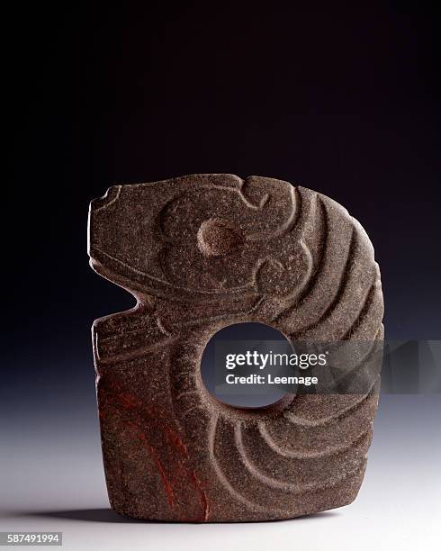 Pre-Columbian art, Maya Civilisation, Classic period : zoomorphic sculpted stone ax representing a stylized snake, 25 x 21 cm - From Bolivia,...