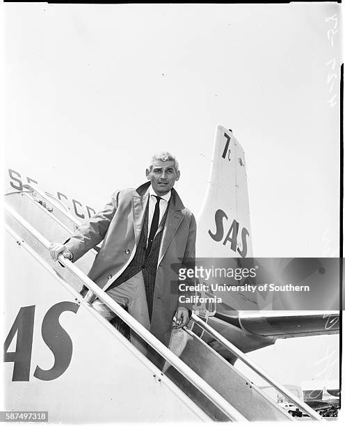 Arrival, Jeff Chandler, It's home again for Jeff Chandler who returned today aboard SAS airliner from Germany', April 27, 1958.