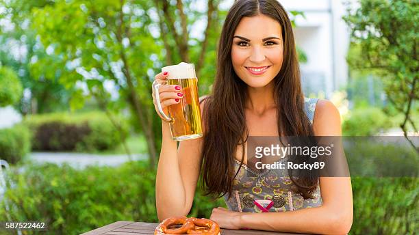 cheers - it's beer fest time! - dirndl stock pictures, royalty-free photos & images