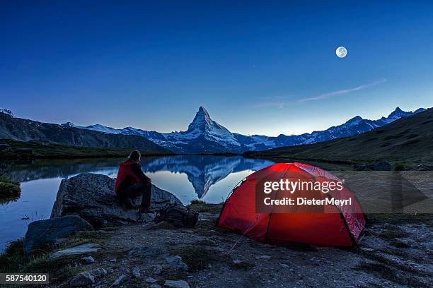 camper under full moon at matterhorn - moon landscape stock pictures, royalty-free photos & images