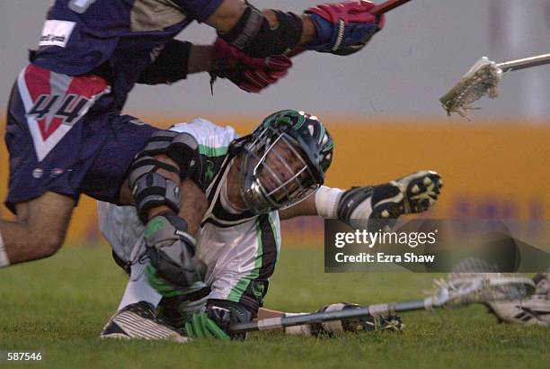 Casey Powell of the Long Island Lizards is trampled by Mike Battista of the Boston Cannons during their game at Cawley Stadium in Hudson,...