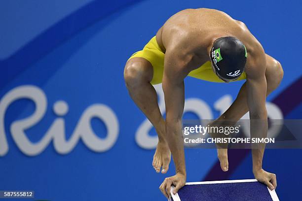 Brazil's Leonardo De Deus warms up before competing in the Men's 200m Butterfly Semifinal during the swimming event at the Rio 2016 Olympic Games at...
