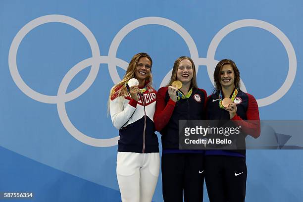Silver medalist Yulia Efimova of Russia, gold medal medallist Lilly King of the United States and bronze medallist Katie Meili of the United States...