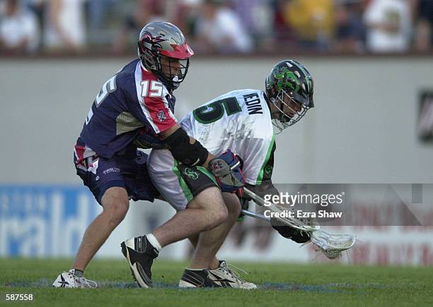 Eric Wedin of the Long Island Lizards fights for the ball with Tim Goldstein of the Boston Cannons during their game at Cawley Stadium in Hudson,...