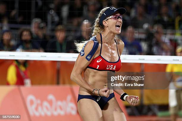 Kerri Walsh Jennings of United States celebrates during the Women's Beach Volleyball preliminary round Pool C match against Fan Wang and Yuan Yue of...