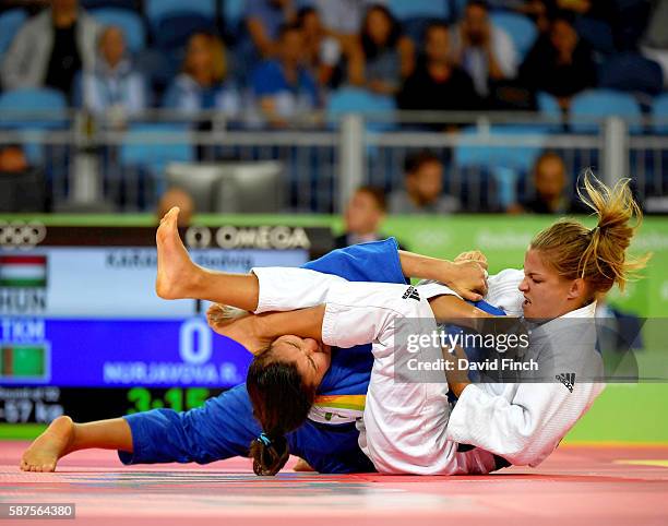 Former junior world champion, Hedvig Karakas of Hungary armlocked Rushana Nurjavova of Turkmenistan into submission to win their u57kg contest during...