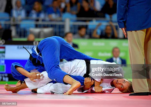 Former junior world champion, Hedvig Karakas of Hungary armlocked Rushana Nurjavova of Turkmenistan into submission to win their u57kg contest during...