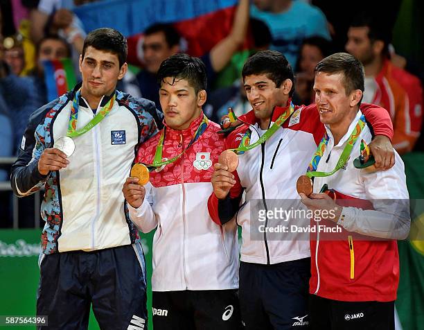 Under 73kg medallists L-R: Silver; Rustam Orujov of Azerbaijan , Gold; Shohei Ono of Japan, Bronzes; Lasha Shavdatuashvili of Georgia and Dirk Van...