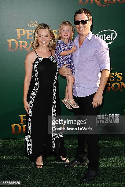 Actress Beverley Mitchell, husband Michael Cameron and daughter Kenzie Cameron attend the premiere of "Pete's Dragon" at the El Capitan Theatre on...