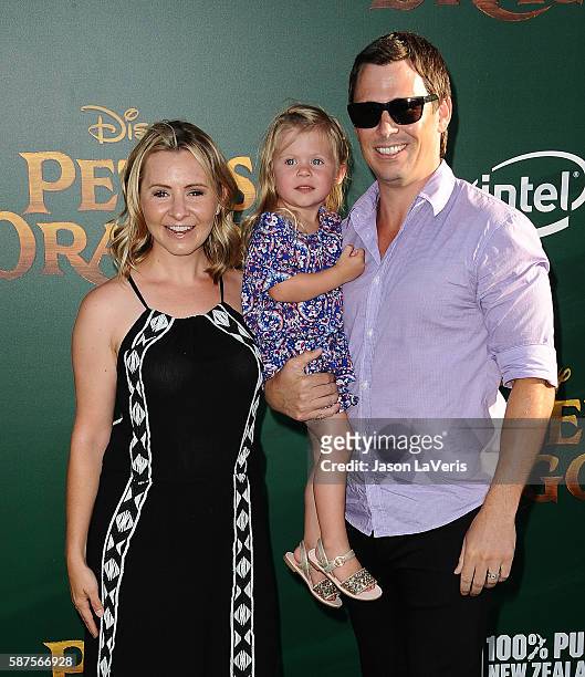 Actress Beverley Mitchell, husband Michael Cameron and daughter Kenzie Cameron attend the premiere of "Pete's Dragon" at the El Capitan Theatre on...