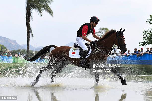 Alex Hua Tian of China riding Don Geniro competes during the Cross Country Eventing on Day 3 of the Rio 2016 Olympic Games at the Olympic Equestrian...