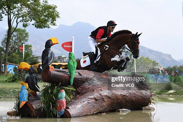 Alex Hua Tian of China riding Don Geniro competes during the Cross Country Eventing on Day 3 of the Rio 2016 Olympic Games at the Olympic Equestrian...