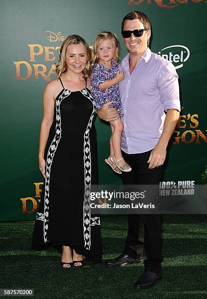 Actress Beverley Mitchell, husband Michael Cameron and daughter Kenzie Cameron attend the premiere of "Pete's Dragon" at the El Capitan Theatre on...