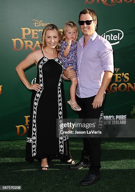 Actress Beverley Mitchell, husband Michael Cameron and daughter Kenzie Cameron attend the premiere of "Pete's Dragon" at the El Capitan Theatre on...