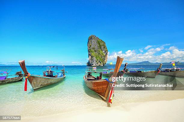 long tailed boat ruea hang yao park at sea in phuket thailand - phi phi island stock pictures, royalty-free photos & images