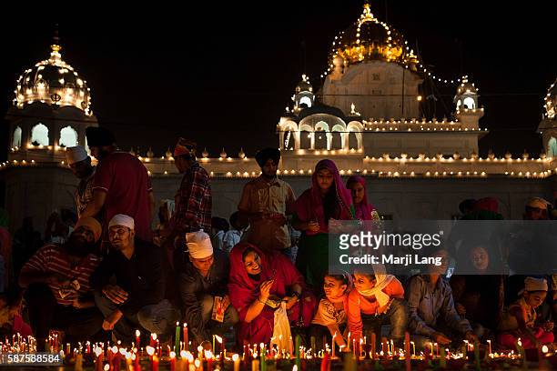 Crowd of devotees celebrating Diwali festival night, also Bandi Chhor Divas celebration for the Sikh religion followers at the Gurdwara Dukh Nivaran...