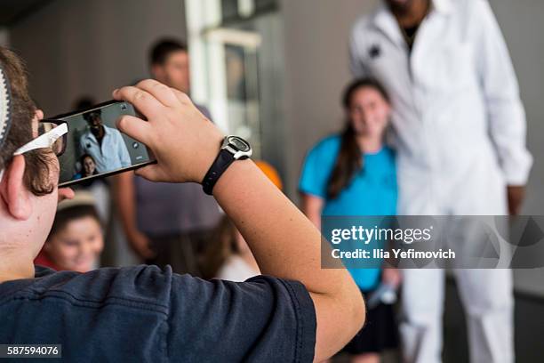 Amar'e Stoudemire a former NBA player seen reacting to childern fans during a visit to Israel Museum on August 9, 2016 in Jerusalem, Israel. Amar'e...