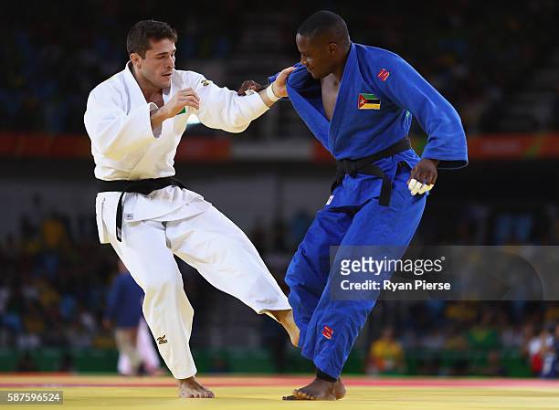 Victor Penalber of Brazil and Marlon Acacio of Mozambique compete during the Men's -81kg bout on Day 4 of the Rio 2016 Olympic Games at the Carioca...