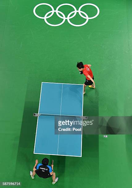 An overview shows Li Xiaoxia of China serving against Cheng I-Ching of Taiwan in their women's singles quarter-final table tennis match at the...