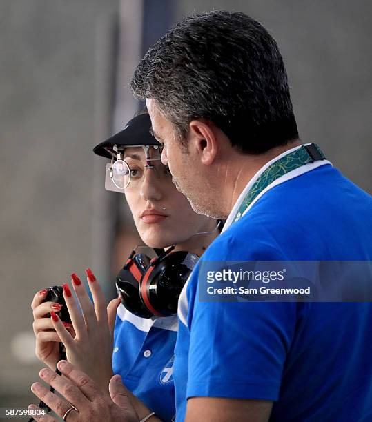 Anna Korakaki of Greece speaks with her coach during the 25m Pistol competition on Day 4 of the Rio 2016 Olympic Games at the Olympic Shooting Centre...