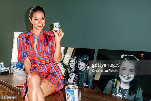 Brazilian singer Fernanda Brandao attends the photo exhibition 'Die Kunst des Kinderlaechelns' by Peter Badge on August 9, 2016 in Berlin, Germany....