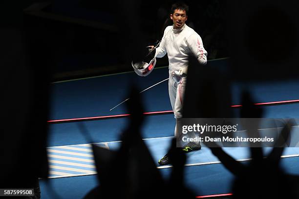 Kazuyasu Minobe of Japan reacts duing the match Marco Fichera of Italy during the Men's Epee Individual against on Day 4 of the Rio 2016 Olympic...