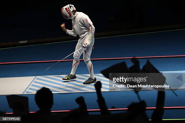 Kazuyasu Minobe of Japan reacts duing the match Marco Fichera of Italy during the Men's Epee Individual against on Day 4 of the Rio 2016 Olympic...